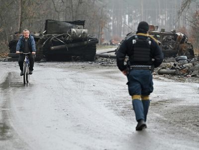 Bodies in town near Kyiv as Russia makes partial retreat