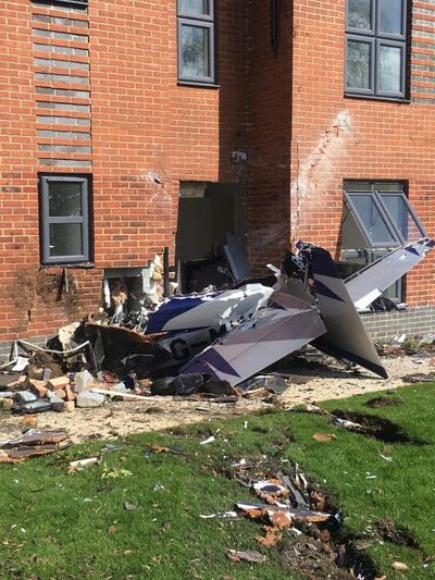 Plane destroyed and pilot injured after crashing into unoccupied block of flats