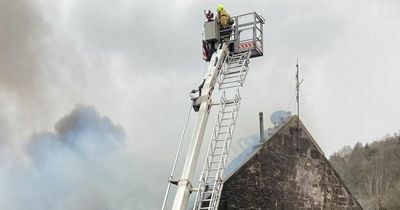 Huge blaze rips through Port Glasgow building as flames billow out from roof