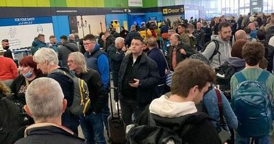 Airport carnage as passengers fear 'someone will get hurt' in crammed queues