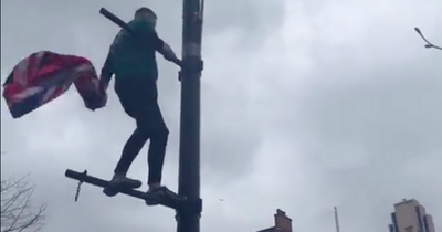 Celtic fan 'cleans up' Rutherglen by removing Union Jack following derby victory over Rangers