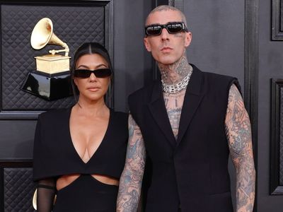 Kourtney Kardashian and Travis Barker wear matching outfits at Grammys