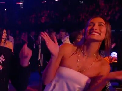 Hailey Baldwin filmed singing along as Justin Bieber serenades Grammys