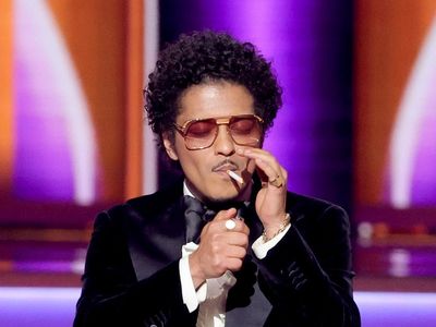 Grammys audience reacts to Bruno Mars lighting cigarette after award win: ‘Can I bum a smoke?’