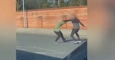 Traffic stops as two men launch into violent street fight at busy junction