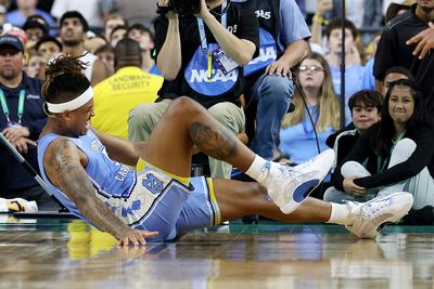 Did UNC’s Armando Bacot re-injure his ankle against Kansas because of the Superdome floor?