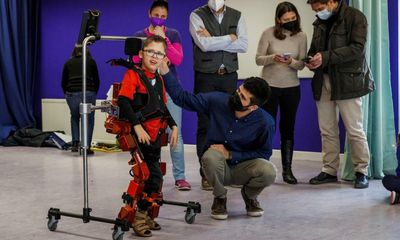 ‘It’s a dream’: exoskeleton allows boy with cerebral palsy to walk and play