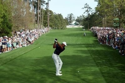 Spotlight on Woods provides respite for McIlroy at Masters