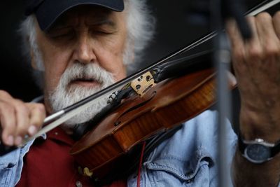 Cajun fiddler Michael Doucet breaks hip on tour in Alaska