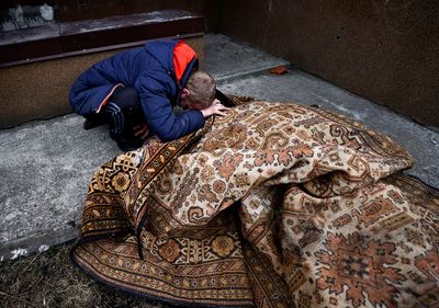 Roadside burial for labourer shot through head in Ukraine's Bucha