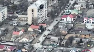 Footage appears to show Russian armoured vehicle firing on cyclist in Ukrainian city of Bucha