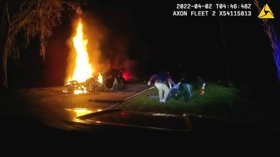 Flaming Heroes: Cops Cut Trapped Driver From Car Inferno With Pocket Knife