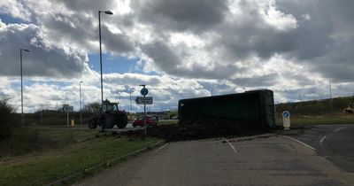 Tractor trailer overturns and spills load across busy roundabout in Nottinghamshire