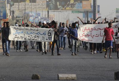 Sudanese mark removal of al-Bashir with protest against army rule