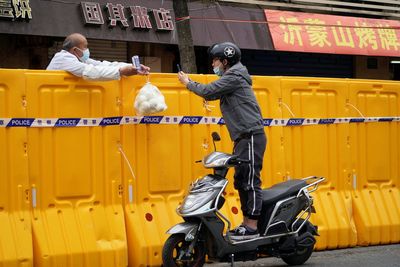 Shanghai vows to improve food deliveries as discontent grows over COVID curbs