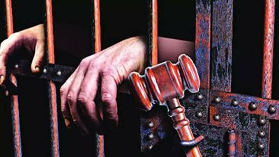 Jailed muscleman Vijay Mishra, son booked under Uttar Pradesh Gangster Act