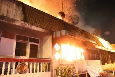 Family of three die as fire guts row of townhouses