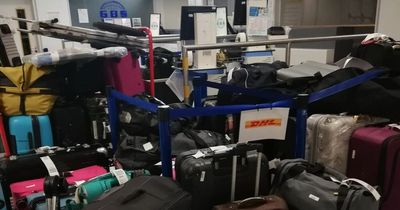 Pictures show hundreds of 'abandoned' suitcases piled up in Manchester Airport baggage hall
