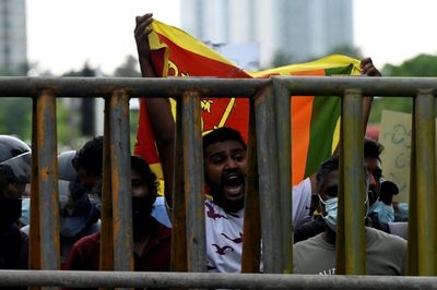 Sri Lanka asks experts to plan debt restructure as protests rage