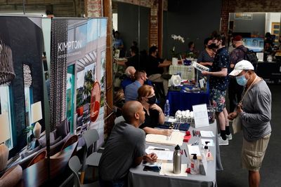 Jobless claims fall to lowest in decade as Biden works to revive economy hit by Covid