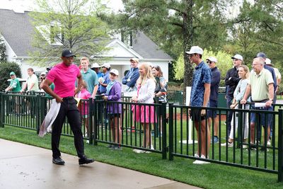 Tiger Woods is wearing a bright, azalea-colored shirt at the Masters and fans love it