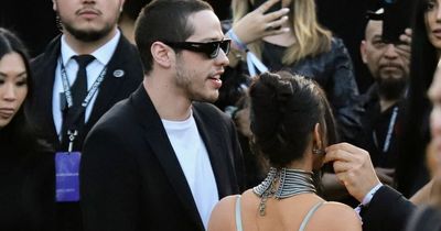 Kim Kardashian makes red carpet debut with Pete Davidson in skintight silver dress