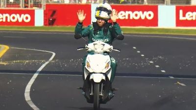 Sebastian Vettel uses fire extinguisher on car during Australian F1 Grand Prix practice