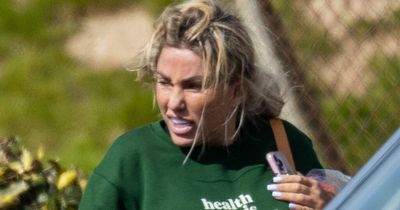 Katie Price ditches engagement ring on the beach after split from fiancé Carl Woods