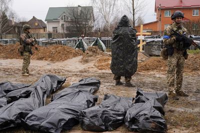 Ukrainian forensic investigators start exhuming bodies from Bucha mass grave