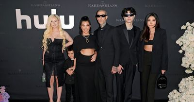 Kourtney Kardashian's gothic family portrait with 'husband' Travis at Hulu premiere