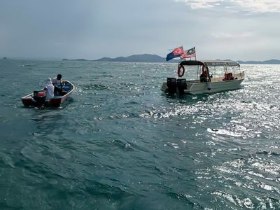 Divers from UK and France found adrift off Malaysia but boy, 14, still missing