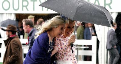 Grand National 2022: Aintree racegoers run for cover as flash showers hit racecourse