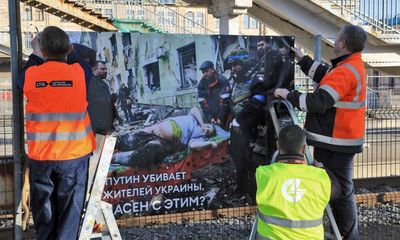 ‘Putin is killing civilians’: the train station where Russians are greeted with images of war