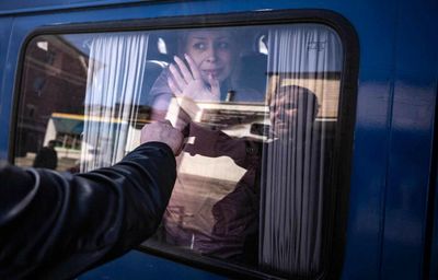 Civilians flee eastern Ukraine after station carnage