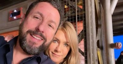 Jennifer Aniston cosies up to co-star Adam Sandler as they shoot Murder Mystery 2 in Paris