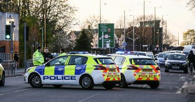 Police shut major south Manchester road after reports of crash