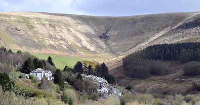 The village at the end of the road with a mountain the other side