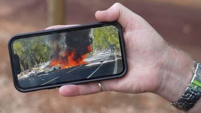 WA Police footage reveals how quick-acting officers saved couple from burning car after Harvey road crash
