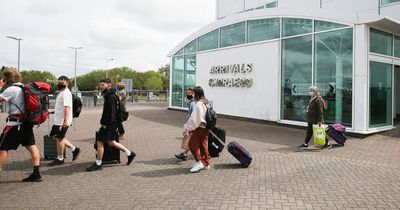 How early do I need to arrive at Cardiff airport?