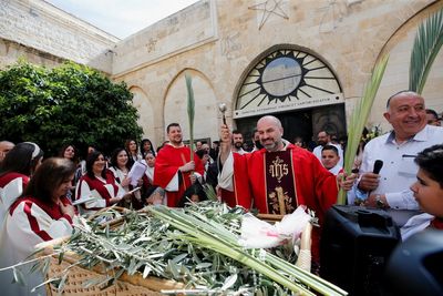 Jerusalem's Holy Sepulchre 'resurrected' for Palm Sunday mass as pilgrims return