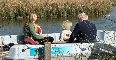Suit-clad Boris Johnson tries to escape political woes on family boat trip