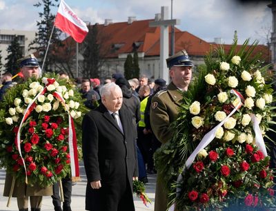 Some sirens sound in Poland's disputed memorial observance