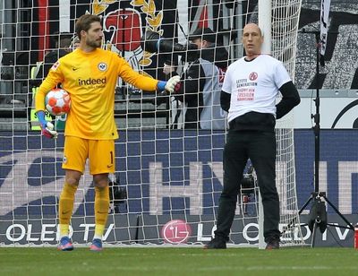 Protestors tie themselves to goal posts and halt Bundesliga match