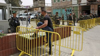 Policeman stabbed in Hebron, assailant shot dead