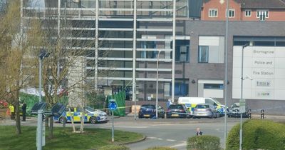 Driver dies after Mercedes van bursts into flames outside police and fire station