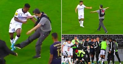 Porto clash halted after fan walks onto pitch and tries to kick player in ugly scenes