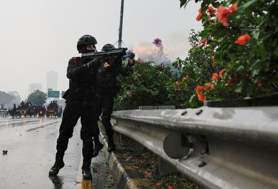 Indonesia police fire tear gas to disperse protest at parliament