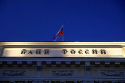 Russia to halt bond sales, threatens legal action over default