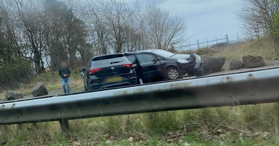 Car ploughs into boulder after two-vehicle smash on Scots road as emergency crews race to scene