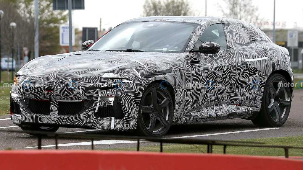 Ferrari Purosangue Spied In Wavy Wrap Revealing More ferrari-purosangue-spied-in-wavy-wrap-revealing-more